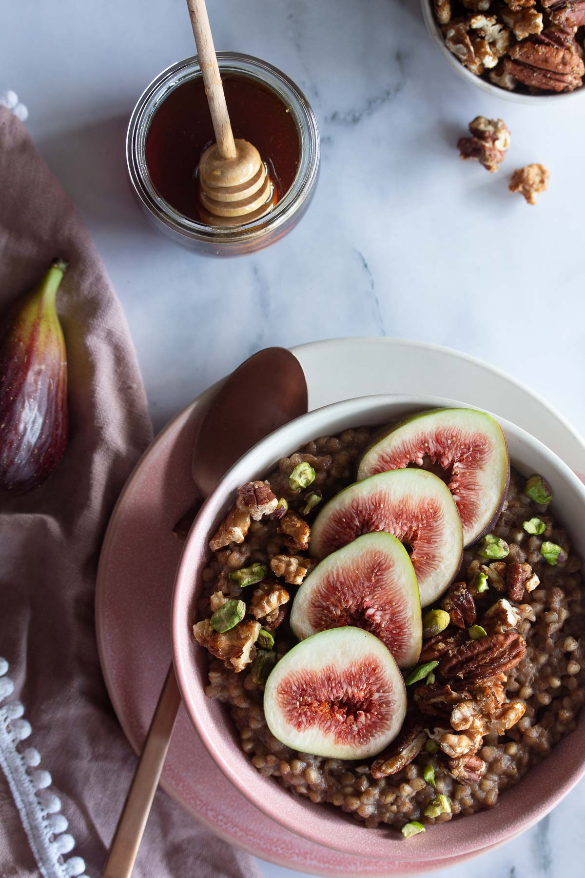 Flatlay image of Baklava Buckwheat Porridge served with figs, candied nuts and honey