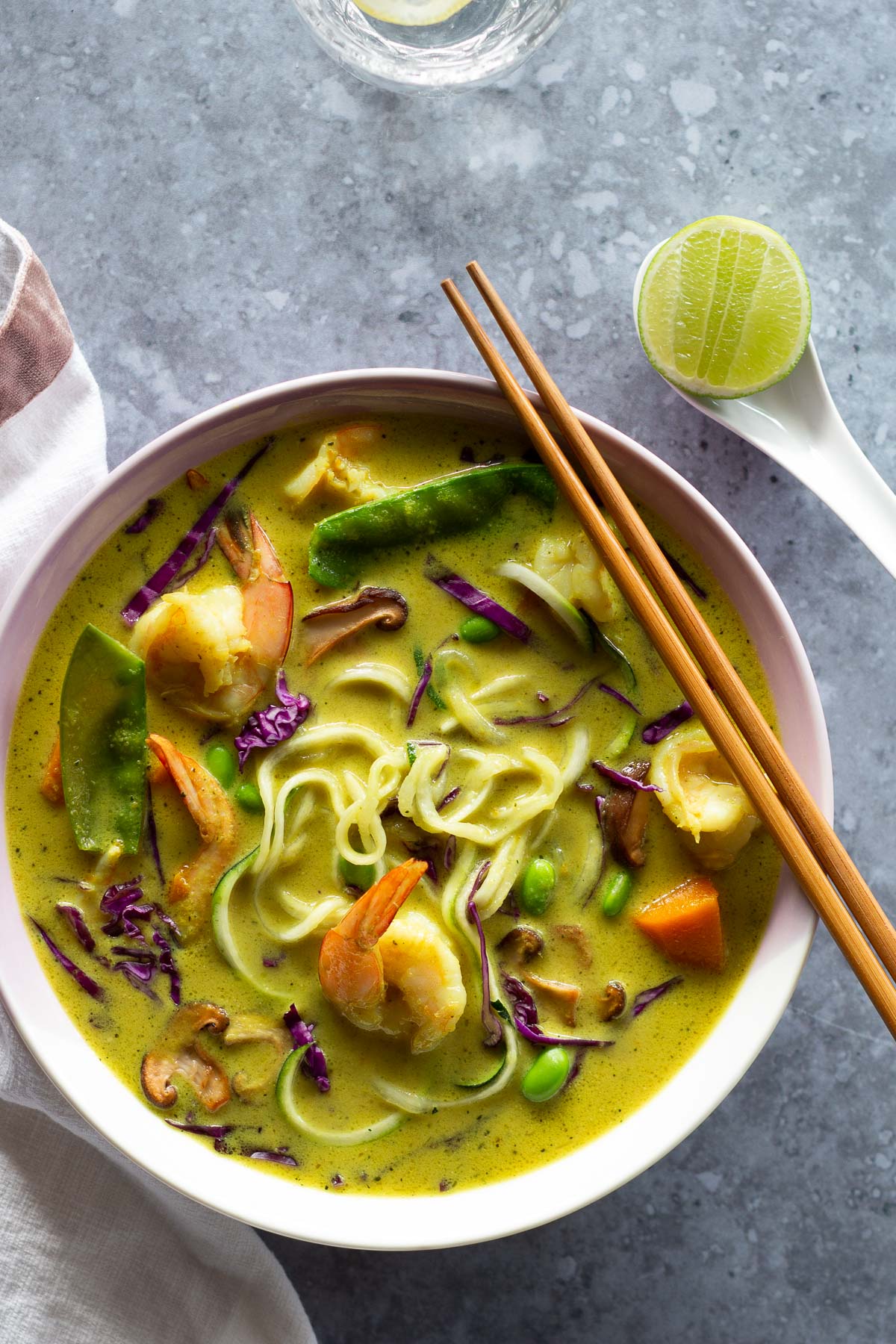 Lemongrass noodle soup packed with tasty veggies, noodles and served with a lime cheek